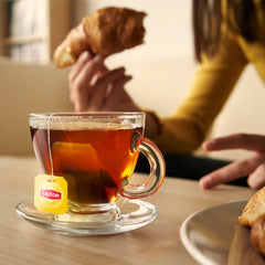 Lipton tea bag close-up of fine-leaf texture and consistent flavor