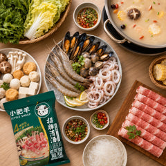 Little Sheep split-pot hotpot in use with both broths, satisfying shared meals