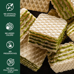 Loacker Quadratini matcha wafers served beside a cup of tea for pairing enjoyment