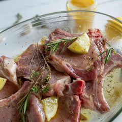 Lupo's grilled chicken plated outdoors, demonstrates bold citrus-garlic flavor