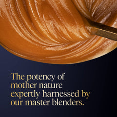 Spoon of Manuka Health honey drizzling onto toast showing natural sweetening use