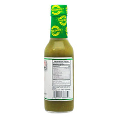 Marie Sharp's pouring sauce on eggs to add balanced mild heat and bright flavor