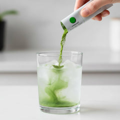 Matcha Kari single stick torn open over cup showing easy portion benefit