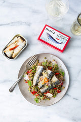Matiz open tin revealing plump sardines preserved in olive oil for rich texture