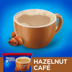 MAXWELL HOUSE pouring mix into a steaming cup for quick, café-style hazelnut flavor