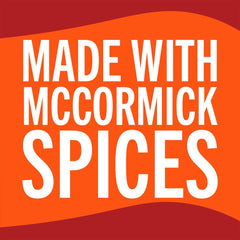 McCormick seasoning poured into skillet adding cheesy Southwest flavor to browned meat