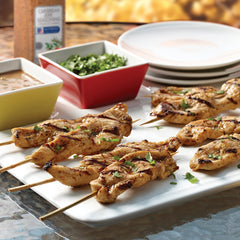 McCormick Culinary seasoned chicken on grill showcasing bold, caramelized jerk flavor