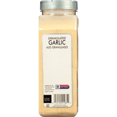 McCormick Culinary granulated garlic poured from spoon showing easy dosing benefit