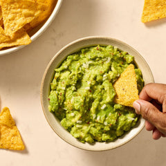 McCormick prepared guacamole in bowl with chips ready to serve