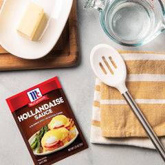 McCormick Hollandaise drizzled over Eggs Benedict highlighting rich lemon-butter finish and brunch upgrade