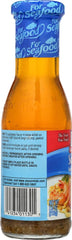 McCormick scampi sauce poured from bottle close-up highlighting texture and rich garlic aroma