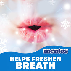 Mentos single piece broken to reveal chewy texture and flavor