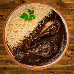 Mi Mole ingredients array displaying chiles, seeds, nuts, and cocoa for depth