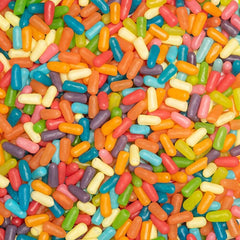 MIKE AND IKE hand holding handful of candies illustrating size and grab-and-go convenience