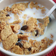 Minimalist whole milk powder reconstituted in bowl with water, brand offers creamy consistency