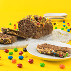 M&M'S halved piece revealing peanut butter center and chocolate layer benefit