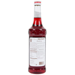 Close-up of Monin blueberry bottle texture and cap highlighting freshness