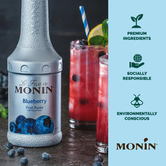 Monin purée measured on a scoop beside a jigger for accurate portioning