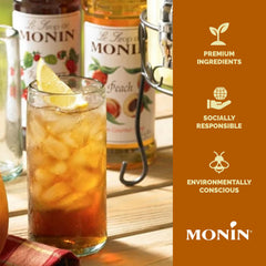 Monin peach syrup mixed in sparkling peach soda glass for refreshing serving