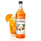 Monin peach syrup front packaging showing bottle and label, highlights convenience