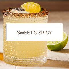 Monin spicy agave pouring into a jigger illustrating easy dosing benefit