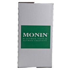 Monin syrup being poured into a latte demonstrating smooth mixing and flavor enhancement