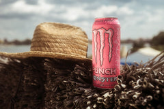 Monster Pipeline Punch by a beach scene conveying tropical flavor and refreshment