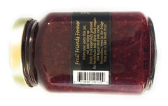 Mountain Fruit Co. spoon lifting jam to show smooth texture and berry bits