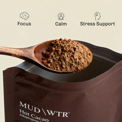 Steaming mug of MUDWTR hot cacao demonstrating comforting warmth
