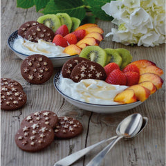 Mulino Bianco cookie dunked in milk emphasizing dunkability and softer center