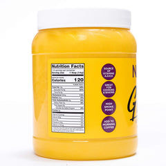 Nanak ghee scooped on a spoon ready to add flavor to recipes