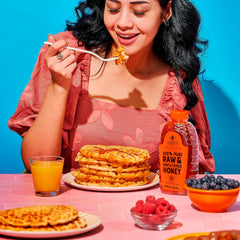 Nate's Honey poured on pancakes lifestyle image highlighting fast breakfast drizzle