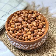 Naturalee close-up of roasted peanut skins highlighting crunchy texture benefit