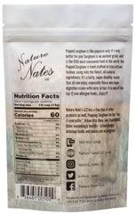Nature Nate's popped sorghum in a bowl being scooped to show serving suggestion and portion control