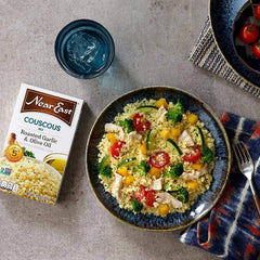 Near East served in bowl with vegetables showcasing versatile meal-ready benefit