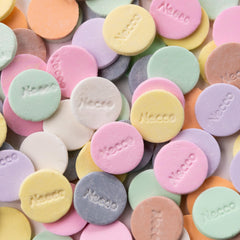 Necco wafer candy held in hand showing scale and easy portability