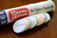 Necco wafer roll close-up displaying colorful stacked wafers and convenience