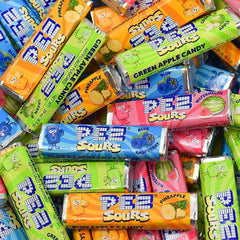 Needzo filled PEZ dispensers in use, demonstrating easy refilling and fun serving