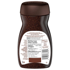 NESCAFÉ Rich decaffeinated being stirred into a cup, demonstrating quick preparation benefit