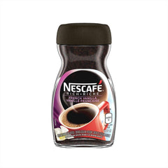 NESCAFÉ open jar revealing fine instant granules, quick dissolving benefit