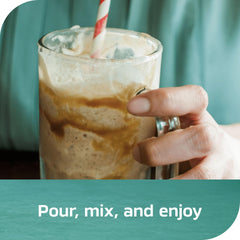 Nescafe concentrate pouring into iced glass showing quick drink prep benefit