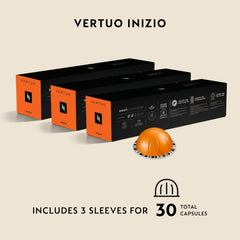 Nespresso Inizio capsule beside Arabica beans illustrating blend origin