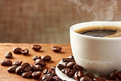 New England Coffee cup poured and served with pastry illustrating enjoyable hazelnut pairing