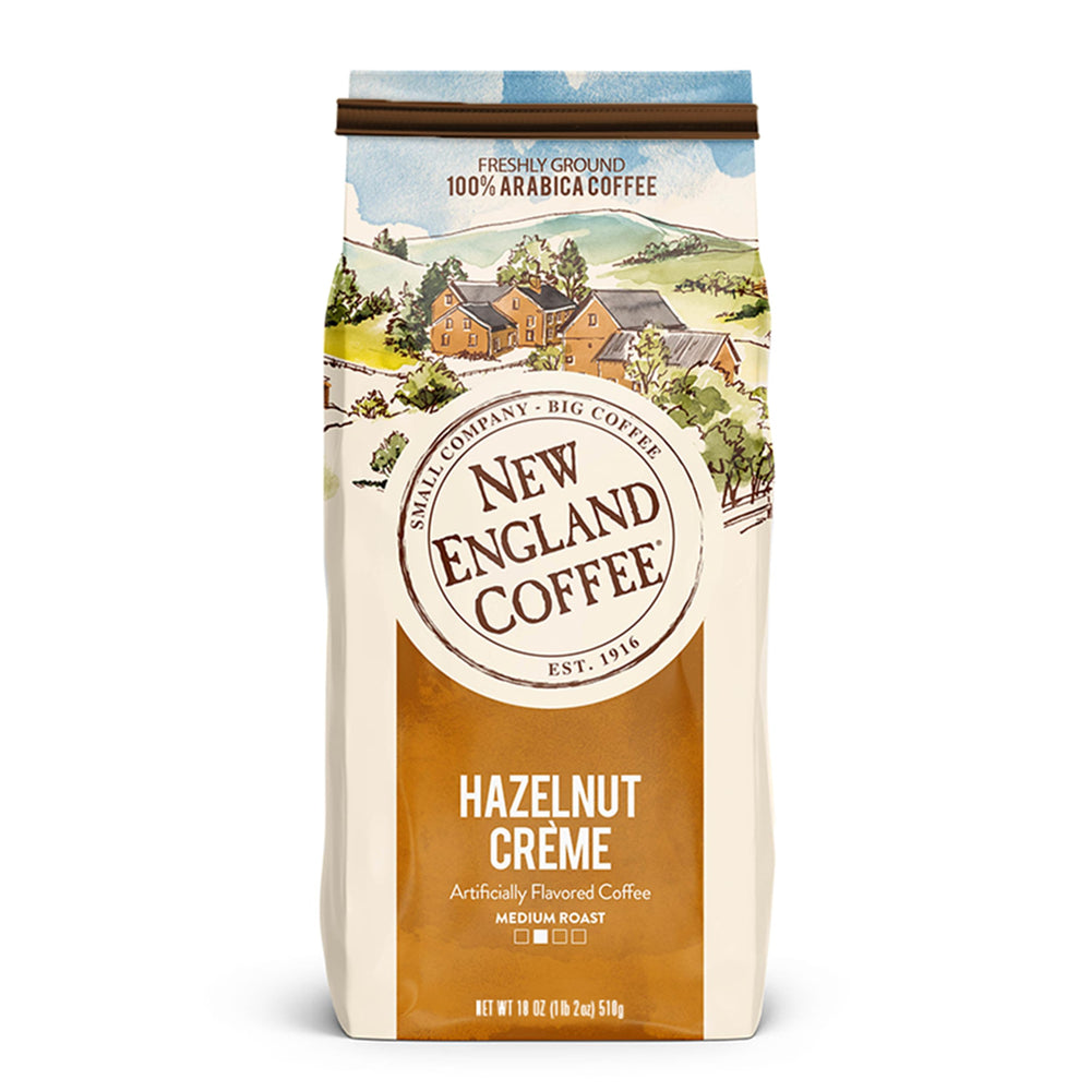 New England Coffee front bag showing hazelnut crème label and net weight, showcases flavor