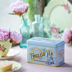 New English Teas tin lid close-up showing airtight seal and Victorian pattern benefit