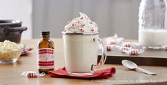 Nielsen-Massey peppermint extract being poured into a bowl demonstrating easy dosing benefit