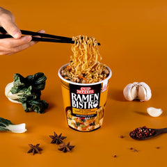 NISSIN close-up of chili-infused noodles highlighting spicy flavor