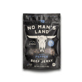No Mans Land front packaging showing black pepper flavor and portable convenience