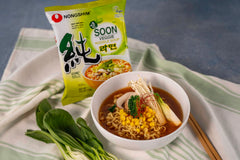 Nongshim dried vegetable flakes scattered to show colorful rehydration boost