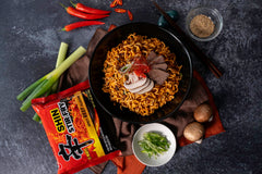 Nongshim close-up of noodles and glossy sauce highlighting chewy texture and flavor